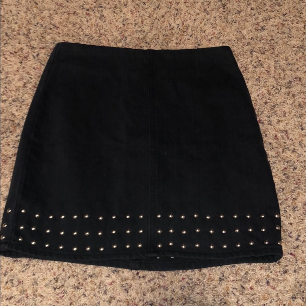 Black denim skirt with studs on the bottom!